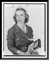 Dr. Joyce Brothers, half-length portrait, facing slightly left, holding book she wrote.World Telegram photo by Phyllis Twacht, Historic Reproduction
