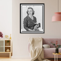 Dr. Joyce Brothers, half-length portrait, facing slightly left, holding book she wrote.World Telegram photo by Phyllis Twacht, Historic Reproduction