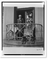 Historic Framed Print, [Sigmund Freud standing on balcony with two dogs],  17-7/8" x 21-7/8"