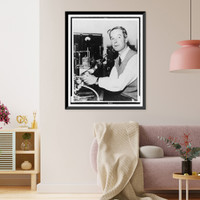 Alan Hodgkin, half-length portrait, facing front, seated at microscope, Historic Reproduction