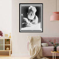 Alexander Graham Bell, seated, facing down, writing and holding pipe, Historic Reproduction