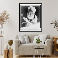 Alexander Graham Bell, seated, facing down, writing and holding pipe, Historic Reproduction