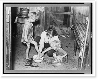 Mother washing feet and cleaning up daughters in sharecropper's shack. Southeast Missouri Farms, Vintage Poster