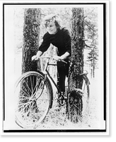 Valentina Nikolaeva-Tereshkova, on bicycle between two trees in wooded area Classic, Antique Print