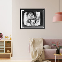 Historic Framed Print, [Photograph of television screen with Valentina Nikolaeva-Tereshkova, head-and-shoulders portrait, in astronaut outfit during her fifth orbit],  17-7/8" x 21-7/8"