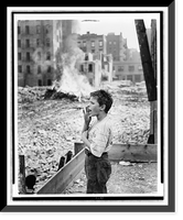 Boy yelling as he stands amid rubble of demolished slums, Vintage Poster