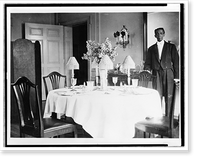 Butler standing by dining room table in residence of Mr. and Mrs. Woodrow Wilson, Historic Reproduction