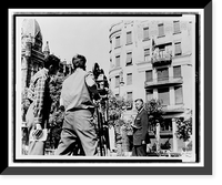 American camera crew films Daniel L. Schorr, with notes in hand, standing in front of the American Legation in Freedom Square, Budapest, Hungary, for the program Hungary Today"" Antique Wall Art