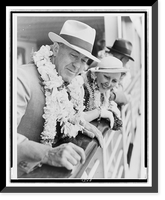 Edgar Rice Burroughs and wife, wearing leis, leaning over ship's rail as they arrive in Hawaii, Vintage Poster