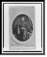 Unidentified Union officer, three-quarter length portrait, standing with coat over right shoulder, left hand resting on table, facing front, Antique Print