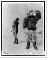 Historic Framed Print, [Frederick Albert Cook, full-length portrait, standing, facing right, wearing fur clothing, in front of arctic" backdrop,  with another man standing behind him]",  17-7/8" x 21-7/8"