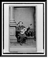 Civil War soldier, with one leg, full-length portrait, seated, facing front, holding guitar, Vintage Poster