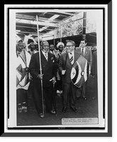 Historic Framed Print, [Henry Kissinger, holding shield and sword, standing with President Jomo Kenyatta, Nairobi, Kenya],  17-7/8" x 21-7/8"