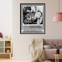 Historic Framed Print, [In a scene from the movie, A Funny thing happened on the way to the Forum,  Zero Mostel, standing behind a wall with a perplexed expression, listens to Michael Crawford, who is hanging upside down],  17-7/8" x 21-7/8"