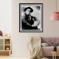 Arch Oboler, half-length portrait, seated, facing right, wearing hat and glasses, holding paper and pencil, Antique Wall Art