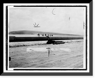 Historic Framed Print, [Camel caravan making its way across desert next to the trans-Arabian oil pipeline],  17-7/8" x 21-7/8"
