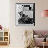 Historic Framed Print, [Young woman, star of Mack Sennett comedy films, full-length portrait, seated on beach chair, facing slightly right],  17-7/8" x 21-7/8"