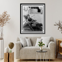 Historic Framed Print, [Young woman, star of Mack Sennett comedy films, full-length portrait, seated on beach chair, facing slightly right],  17-7/8" x 21-7/8"