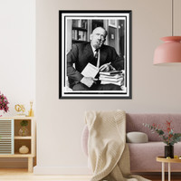 John Steinbeck, three-quarter length portrait, seated, facing front, holding copy of his book Travels with Charley"", Vintage Poster