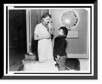 Historic Framed Print, [Clare Boothe Luce and Shirley Temple, standing, facing each other, smiling, on movie set(?) with miniature car, Hollywood, 1936],  17-7/8" x 21-7/8"