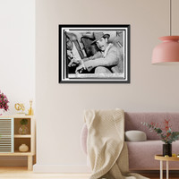 Howard Hughes, seated in automobile at National Airport, facing front, Vintage Poster