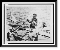 Charles Lindbergh on deck of boat at dock, with hand on tiller, Vintage Wall Art