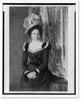 Young African American woman, three-quarter length portrait, facing slightly right, with hands folded on her lap, Historic Print