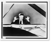 Historic Framed Print, [Artur Rubinstein seated at a grand piano, with his hands raised],  17-7/8" x 21-7/8"