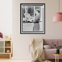 Alma Hitchcock, three-quarter length portrait, left profile, holding poster of Alfred Hitchcock's film, Rear window"", Vintage Wall Art