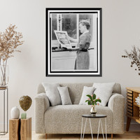 Alma Hitchcock, three-quarter length portrait, left profile, holding poster of Alfred Hitchcock's film, Rear window"", Vintage Wall Art