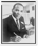 James Meredith, head-and-shoulders portrait, facing right, signing a document, Vintage Poster