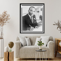 James Meredith, head-and-shoulders portrait, facing right, signing a document, Vintage Poster