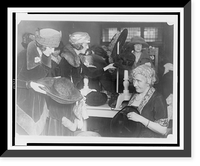 Mrs. Lawrence Townsend at the fourth annual rummage sale of the Child Welfare Society trims discarded hats for the price of one year's milk supply for a Washington baby, Vintage Poster