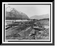 Bird's-eye view of Eddy, Montana, showing buildings, railroad tracks along river, and snow-capped mountains in background, Vintage Print