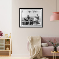 Historic Framed Print, [Soviet soldiers in the field at Novorossiisk, one sewing on a machine while another has a haircut or shave].Evgenii Khaldei.,  17-7/8" x 21-7/8"