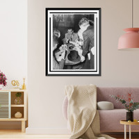 Historic Framed Print, [Erich Maria Remarque, seated, surrounded by reporters aboard the S.S. Queen Mary as it arrives in New York],  17-7/8" x 21-7/8"