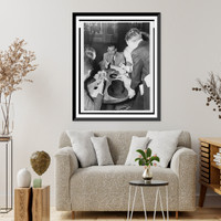 Historic Framed Print, [Erich Maria Remarque, seated, surrounded by reporters aboard the S.S. Queen Mary as it arrives in New York],  17-7/8" x 21-7/8"