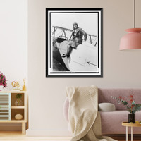 Marvel Crosson, full-length portrait, seated on top of airplane, Antique Print
