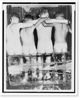 Four naked boys, viewed from behind, sitting on large blocks of ice Classic, Historic Print