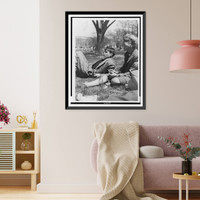 Historic Framed Print, [FSA staff members John Collier, reclining, and Jean Lee, smoking, taking a break out-of-doors],  17-7/8" x 21-7/8"