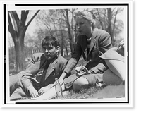 Historic Framed Print, [FSA staff members John Collier, reclining, and Jean Lee, eating an apple, taking a break out-of-doors],  17-7/8" x 21-7/8"