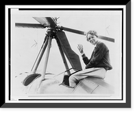 Amelia Earhart, waving, seated outside cockpit on top of an autogiro, in Los Angeles, after completing transcontinental flight, Antique Wall Art