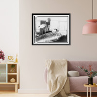Konstantin Tsiolkovsky, half-length portrait, facing front, looking down at model of an early Russian rocket, Historic Print