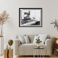 Konstantin Tsiolkovsky, half-length portrait, facing front, looking down at model of an early Russian rocket, Historic Print
