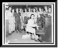Irving Berlin, full-length portrait, seated at piano, facing front, playing one of his songs as WACs sing, WAC mess hall, Papua New Guinea.Signal Corps Photograph, Vintage Print