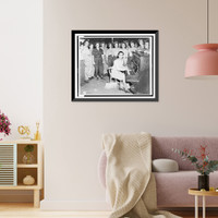 Irving Berlin, full-length portrait, seated at piano, facing front, playing one of his songs as WACs sing, WAC mess hall, Papua New Guinea.Signal Corps Photograph, Vintage Print
