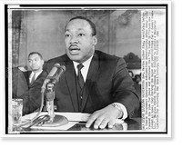 Historic Framed Print, [Rev. Martin Luther King, head-and-shoulders portrait, seated, facing front, testifying before a Senate government operations committee investigating urban decay],  17-7/8" x 21-7/8"