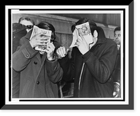 Two Hunter College students covering their faces with books, at police headquarters after they were picked up on narcotics.World Telegram & Sun photo by Herman Hiller, Antique Wall Art