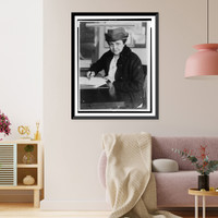 Historic Framed Print, [Frances Perkins, half-length portrait, facing front, signing document],  17-7/8" x 21-7/8"