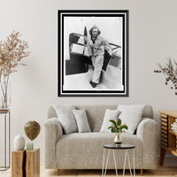 Historic Framed Print, [Beryl Markham, full-length portrait, standing, facing front, getting out of airplane],  17-7/8" x 21-7/8"